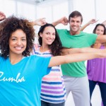 Fitness class and instructor doing pilates exercise