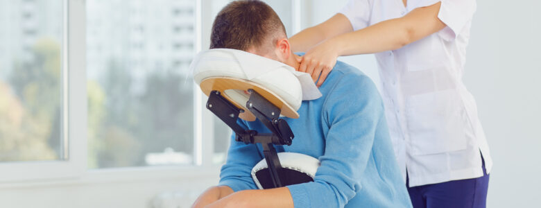 Massage On The Massage Chair In The Office.